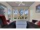 Sunroom with water views, wicker furniture, and ceiling fan at 1723 Live Oak Park # 1723, Seabrook Island, SC 29455