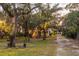 Spacious backyard with mature trees and a charming home at 1860 Headquarters Plantation Dr, Johns Island, SC 29455