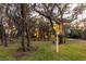 Picturesque backyard with home view, lit at dusk at 1860 Headquarters Plantation Dr, Johns Island, SC 29455