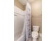 Clean bathroom with shower/tub combo and patterned shower curtain at 1860 Headquarters Plantation Dr, Johns Island, SC 29455