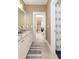 Double vanity bathroom with granite countertop and access to bedroom at 1860 Headquarters Plantation Dr, Johns Island, SC 29455