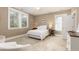 Cozy bedroom with a white bed and carpet flooring at 1860 Headquarters Plantation Dr, Johns Island, SC 29455