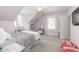 Bedroom with gray bedding, large window, and neutral decor at 1860 Headquarters Plantation Dr, Johns Island, SC 29455