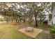Wooden deck with bench overlooking a tranquil backyard landscape at 1860 Headquarters Plantation Dr, Johns Island, SC 29455