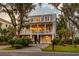 Two story home with gray siding, large front porch, and two car garage at 1860 Headquarters Plantation Dr, Johns Island, SC 29455