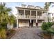 Two story home with gray siding, large front porch, and two car garage at 1860 Headquarters Plantation Dr, Johns Island, SC 29455