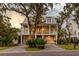 Two story home with a large porch and two car garage at 1860 Headquarters Plantation Dr, Johns Island, SC 29455