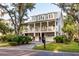 Two story home with a large porch and two car garage at 1860 Headquarters Plantation Dr, Johns Island, SC 29455
