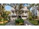 Two story home with gray siding, large front porch, and two car garage at 1860 Headquarters Plantation Dr, Johns Island, SC 29455