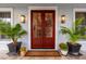 Red double front door flanked by potted plants at 1860 Headquarters Plantation Dr, Johns Island, SC 29455