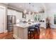 Modern kitchen with white cabinets, island, and stainless steel appliances at 1860 Headquarters Plantation Dr, Johns Island, SC 29455