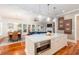 Open kitchen with island, built-in oven and view into Gathering room at 1860 Headquarters Plantation Dr, Johns Island, SC 29455