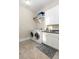 Laundry room with white cabinets and shelving at 1860 Headquarters Plantation Dr, Johns Island, SC 29455