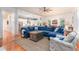 Spacious living room boasts a large sectional sofa, hardwood floors, and an open floor plan at 1860 Headquarters Plantation Dr, Johns Island, SC 29455