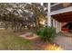 Backyard patio with seating area and landscape lighting at 1860 Headquarters Plantation Dr, Johns Island, SC 29455
