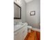 Powder room with patterned wallpaper and white vanity at 1860 Headquarters Plantation Dr, Johns Island, SC 29455