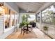 Relaxing screened porch with outdoor seating and dining area at 1860 Headquarters Plantation Dr, Johns Island, SC 29455
