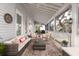 Large screened porch with comfortable seating and outdoor rug at 1860 Headquarters Plantation Dr, Johns Island, SC 29455