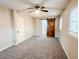 Spacious bedroom with new carpeting and a barn door leading to an ensuite at 200 Elliott Dr, Ladson, SC 29456