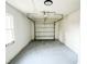 Spacious garage with overhead door and concrete floor at 200 Elliott Dr, Ladson, SC 29456