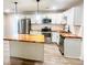 Modern kitchen with butcher block island, stainless steel appliances, and white cabinets at 200 Elliott Dr, Ladson, SC 29456