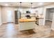 Modern kitchen with butcher block island, stainless steel appliances, and white cabinets at 200 Elliott Dr, Ladson, SC 29456