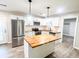Modern kitchen with butcher block island, stainless steel appliances, and white cabinets at 200 Elliott Dr, Ladson, SC 29456