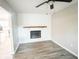 Living room with a modern electric fireplace and built-in shelving at 200 Elliott Dr, Ladson, SC 29456