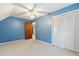 Bright bedroom featuring blue walls and built-in closet at 220 Runnymede Ln, Summerville, SC 29485