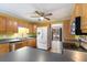 Kitchen features wood cabinets, stainless steel appliances, and laminate flooring at 220 Runnymede Ln, Summerville, SC 29485