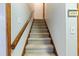 Carpeted staircase with wooden handrail at 220 Runnymede Ln, Summerville, SC 29485