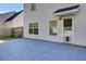 Home's backyard features a patio, wooden fence, and access door at 230 Eagle Ridge Rd, Summerville, SC 29485