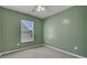 Empty bedroom with green walls, neutral carpet, and a window with blinds at 230 Eagle Ridge Rd, Summerville, SC 29485
