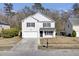Two-story house with white siding, black shutters, and a two-car garage at 230 Eagle Ridge Rd, Summerville, SC 29485