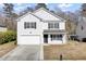 Two-story house with white siding, black shutters, and a two-car garage at 230 Eagle Ridge Rd, Summerville, SC 29485