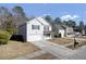Two story house on a tree-lined street with other houses visible at 230 Eagle Ridge Rd, Summerville, SC 29485