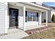 Covered front porch with black door and side windows at 230 Eagle Ridge Rd, Summerville, SC 29485