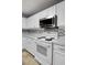 White kitchen with stainless steel appliances and backsplash at 230 Eagle Ridge Rd, Summerville, SC 29485