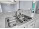 Kitchen features a double sink and marble-look countertops at 230 Eagle Ridge Rd, Summerville, SC 29485