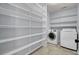 Laundry room with washer, dryer, and ample shelving at 230 Eagle Ridge Rd, Summerville, SC 29485