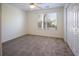 Simple bedroom with window, closet, and carpet flooring at 2323 Tall Sail Dr # F, Charleston, SC 29414