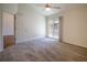 Spacious bedroom with plush carpeting and private balcony access at 2323 Tall Sail Dr # F, Charleston, SC 29414