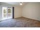 Bright bedroom featuring a private balcony and carpet flooring at 2323 Tall Sail Dr # F, Charleston, SC 29414