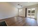 Living room with hardwood floors and access to a private balcony at 2323 Tall Sail Dr # F, Charleston, SC 29414