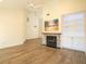 Living room with fireplace, built-in shelving, and vaulted ceiling at 2323 Tall Sail Dr # F, Charleston, SC 29414