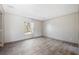 Bright bedroom with wood-look floors and a large window at 240 Carolina Dr, Saint Stephen, SC 29479