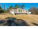 New home with deck and surrounding undeveloped land at 240 Carolina Dr, Saint Stephen, SC 29479