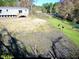 Back of manufactured home near a creek, with deer visible in the background at 240 Carolina Dr, Saint Stephen, SC 29479
