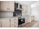 Modern kitchen with stainless steel range and hood at 240 Carolina Dr, Saint Stephen, SC 29479