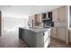 Modern kitchen with an island, stainless steel appliances, and light wood cabinets at 240 Carolina Dr, Saint Stephen, SC 29479